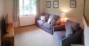 Ground floor sitting room with 43 inch 4K TV and deluxe sofa bed (small double)
