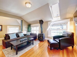 Cozy gas fireplace and lots of natural light from skylights