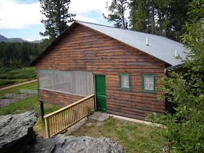 The east side of the cabin showing the sleeping porch.