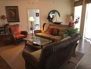 Living room has comfortable seating and flat screen TV