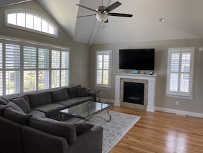 Large open living space with 65" TV