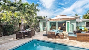 There are plenty of outdoor dining and lounging options surrounding the pool...