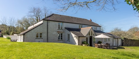 The Farmhouse surrounded by a lovely garden