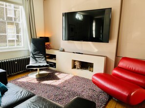 Living room with 65” TV and sound system 