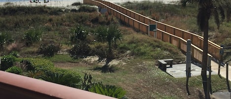 Balcony view! New boardwalk to the beach from our building.