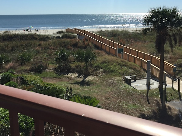 Balcony view! New boardwalk to the beach from our building.