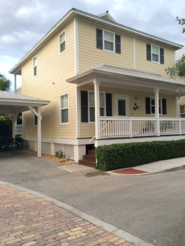 Front of house - stand alone house with car port next to Club House