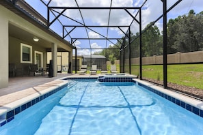 The whole family will love the private screened-in pool and spillover spa