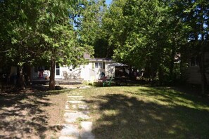 Large yard with campfire and deck 