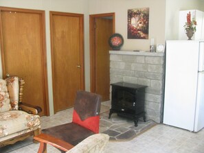 An electric fireplace for cool spring and fall evenings warms the living area.