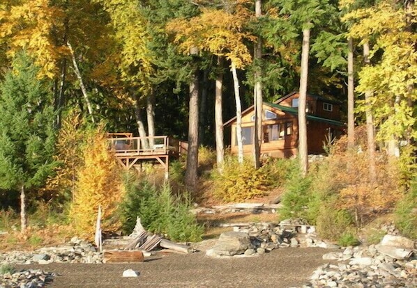 Autumn view of cabin from lake
