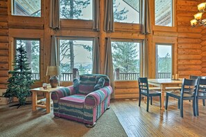 A giant wall of windows frame views of the peaceful woodlands beyond!