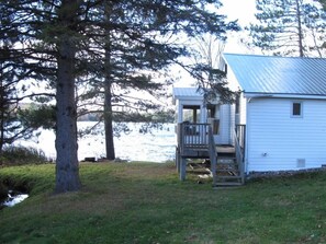 Cottage from road, seeing lake