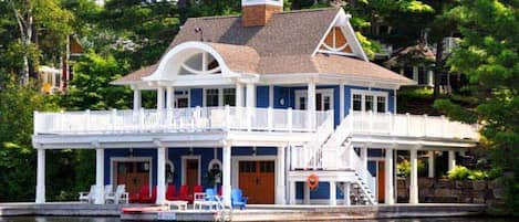 The boathouse offers  an enclosed area compete with a gas fireplace. Outside there is plenty of space with tables and chairs on the upper deck and swimming from the platform