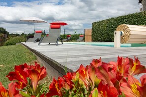 Low view of pool towards vines