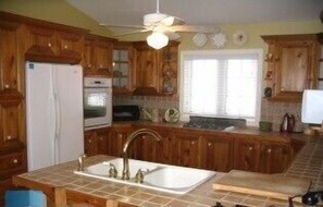 Kitchen with gas range, built-in oven, microwave and dishwasher