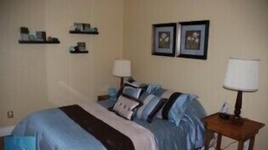Bedroom #1 with double bed and pine floors