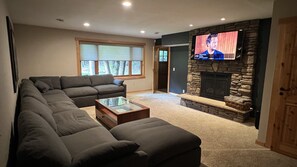 Cloud sectional and 65” Sony 4k