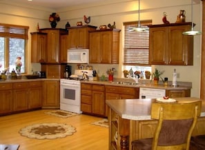 Kitchen with view of NATURAL CREEK running through front of the Property!