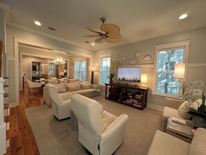 Spacious living area with high-end furnishings, serene decor, Frame smart-TV