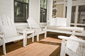 Screened porch with swing-bed...everyone’s favorite spot