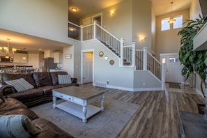 Main Floor Living Room with huge wide open ceilings and views