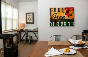 The Spinnaker Studio includes a dining area with chairs for four.