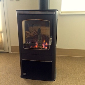 Cozy propane heating stove.