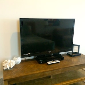 Wide screen tv with satellite reception and DVR.