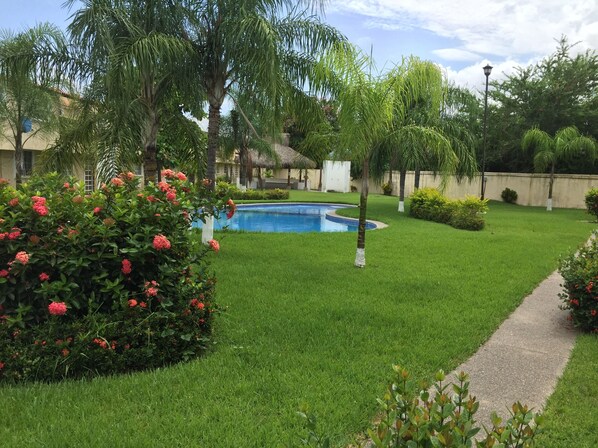 Gardens surrounding pool