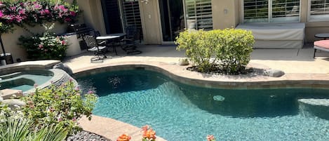 Backyard with saltwater pool and spa