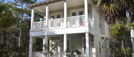 Sunny front porch and balcony adjacent to walking trail