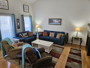 Large Living Room with Fireplace and 49" tv with ROKU device.