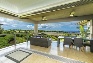 Living room extends out to upper lanai with ocean views