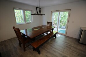Patio doors leading to back yard and hot tub!