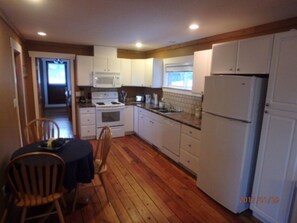 Full kitchen with dishwasher.