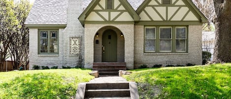 Front of Home from street. The stained glass windows are indicative of the 1920s