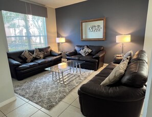 Living room with comfortable leather sofas