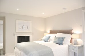 Bedroom 1: Relax in the King size bed with oversized duvet and comfy pillows