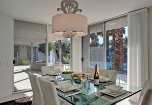 Dining room surrounded by stunning views and light.