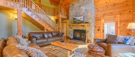 Living Room with Wood Burning Fireplace and Leather Furniture