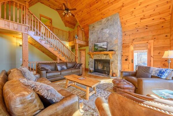 Living Room with Wood Burning Fireplace and Leather Furniture