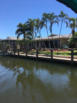 View of the back of the home from the water. Lots of docking space for friends! 