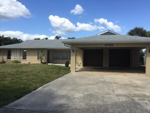 Nice car port with a two attached garage. 