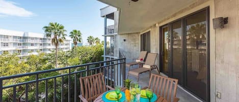 The private balcony has an outdoor dining table for four...