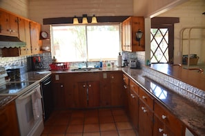 Granite Kitchen and breakfast bar for 4 to right, Dining Room to right of it