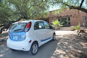 My Mitsubishi electric car in front of Casita 5, casita 4 is to the right palms