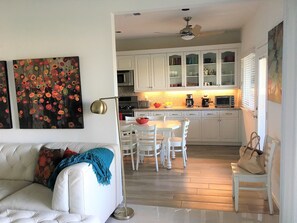 Walk-through between living room & kitchen eating area on lakeside of the house.