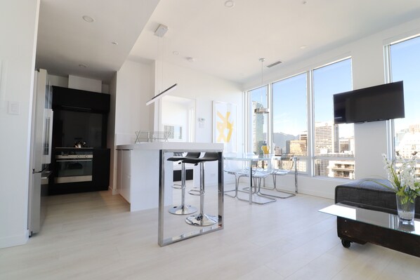 Open-concept living space with floor-to-ceiling and wall-to-wall windows