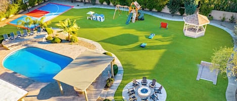 [Resort Property] Backyard amenities with heated pool, basketball court, playground, grill and firepit areas